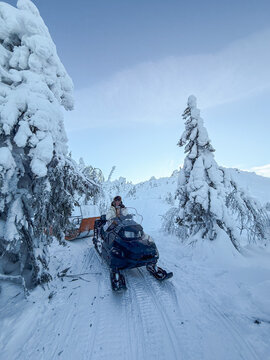 Woman on Snowmobile Trail