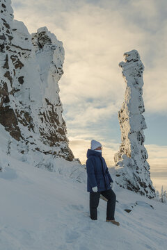 Person Between Winter Rocks
