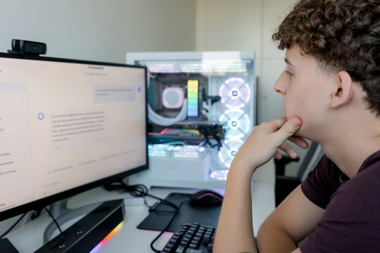 Young man using AI tools on gaming computer