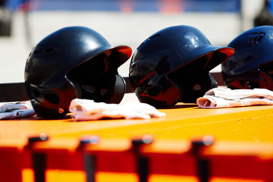 Baseball Helmets On Dugout Bench