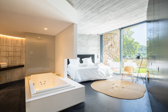 Luxury villa bedroom with bathtub in Catalonia