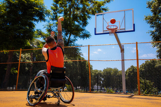 Wheelchair Basketball Player Shooting on Outdoor Court