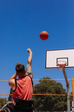 Wheelchair Basketball Player Shooting Outdoors On Court