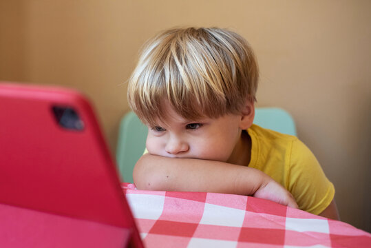 Boy watching cartoon on a tablet
