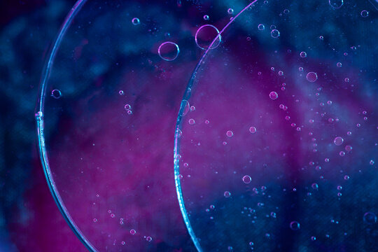 Abstract microscopic bubbles in colorful scientific liquid