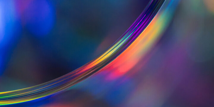 Rainbow light spectrum curve on abstract dark background