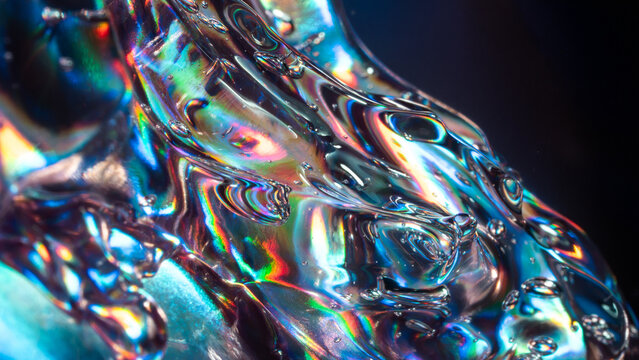 Iridescent liquid glass texture with abstract rainbow refraction
