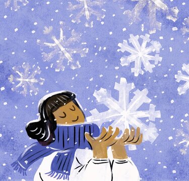 Smiling girl  holding a giant snowflake