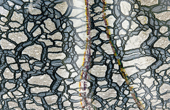 Abstract pattern inside handmade glass paperweight closeup