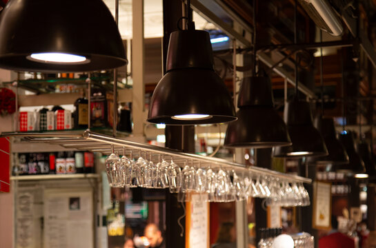 Mercado de San Miguel interior with lamps in Madrid