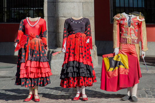 Traditional costume display with flamenco dress and bullfighter