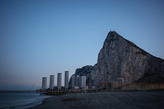 Gibraltar Rock and coastal skyline at blue hour