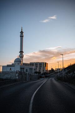 Mosque and minaret beside road at sunset in Gibraltar