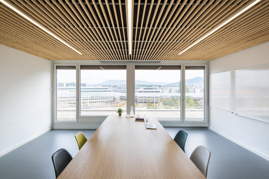 Modern coworking office with conference table and city view
