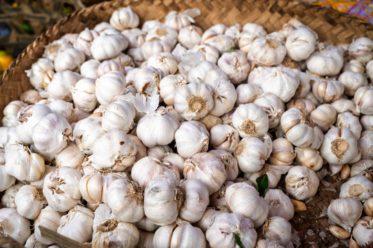 Fresh garlic bulbs at a traditional market stall