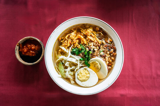Mie ayam noodle soup with chicken, egg and vegetables