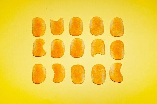 Assorted potato chips arranged in a neat grid pattern