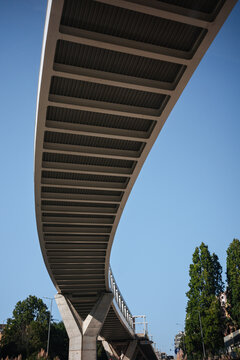 Curved modern bridge over street in Porto, Portugal
