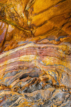 Colorful sedimentary layers in abstract geological formation