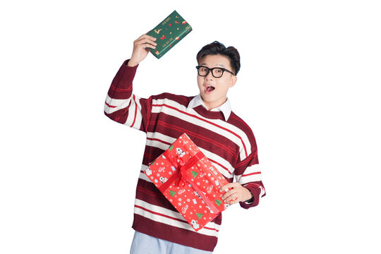 Christmas Gift Mishap: A young man in a festive sweater throws a Christmas gift up in the air in frustration, clutching another gift, looking overwhelmed and exasperated by the holiday spirit.