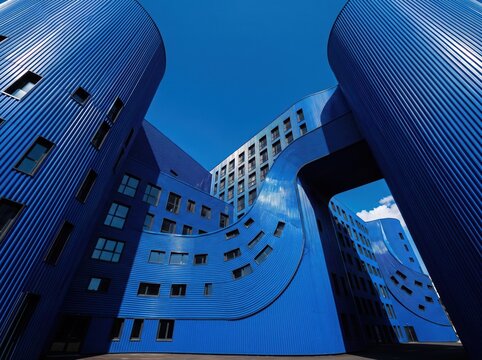 Abstract geometric blue architecture with curved modern facades
