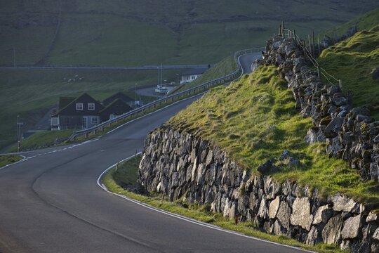 Country road with old stone walls, B&oslash;ur, V&aacute;gar, Faroe Islands, Denmark