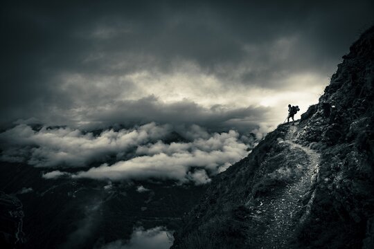 Climber on mountain trail in bad weather, S&ouml;lden, &Ouml;tztal, Tyrol, Austria