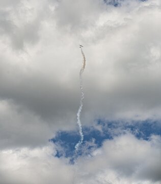 Aeroplane in steep climb, aerobatics, Apex Ceapr CAP 222, cloudy sky, Air Show, Le Bourget, Paris, France