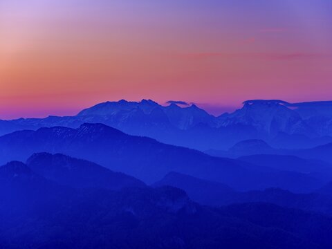Blue mountain silhouettes at sunrise, Berchtesgaden Alps from the Kampenwand, Aschau im Chiemgau, Upper Bavaria, Bavaria, Germany
