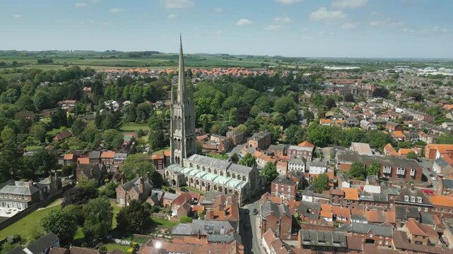 Aerial view of historic town with tall church spire