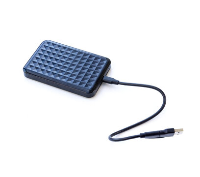 Black external hard drive connected with a USB cable