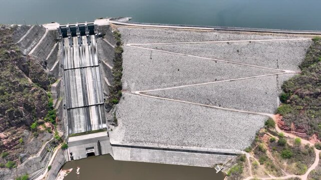 El Quimbo Reservoir Surrounded by Mountains along the Magdalena River in Huila, Colombia. Establishing Shot. Aerial View.