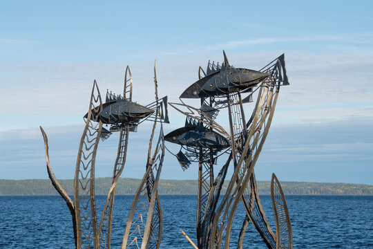 PETROZAVODSK, RUSSIA - SEPTEMBER 25, 2026: Art object Onega FishKi (Onega fish) close-up on the background of Onega lake. Petrozavodsk, Karelia