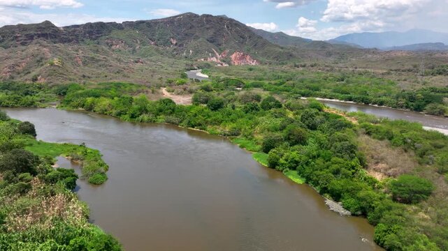 El Quimbo Hydroelectric Dam and Reservoir on the Magdalena River in Huila, Colombia. Establishing Shot. Aerial View.