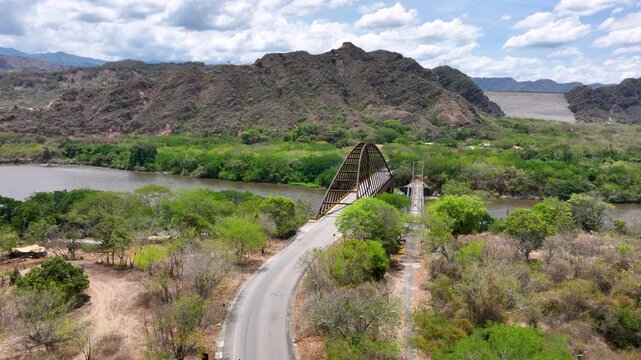 El Quimbo Hydroelectric Dam and Reservoir on the Magdalena River in Huila, Colombia. Establishing Shot. Aerial View.