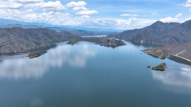 Expansive El Quimbo Hydroelectric Reservoir and Mountain Landscape in Huila, Colombia. Establishing Shot. Aerial View.