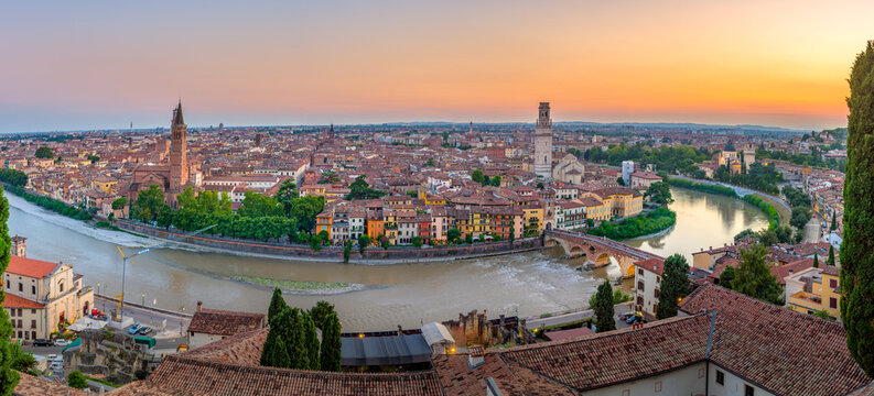Verona, Italy at sunset with historic bridge over the Adige River