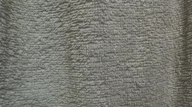 Motion of Aged Bright Green Terry Cloth Towel Texture 4K Footage