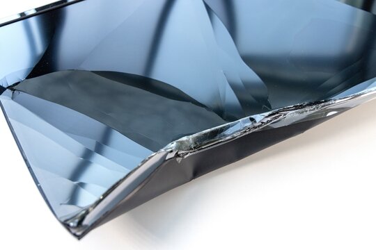 Damaged flat screen television with a shattered panel display