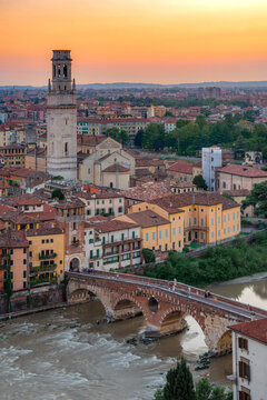 Verona, Italy at sunset with historic bridge over the Adige River