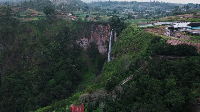 Sipiso Piso Waterfall in North Sumatra, Indonesia &ndash; Cinematic Drone Aerial View of Tropical Waterfall and Lush Mountain Landscape