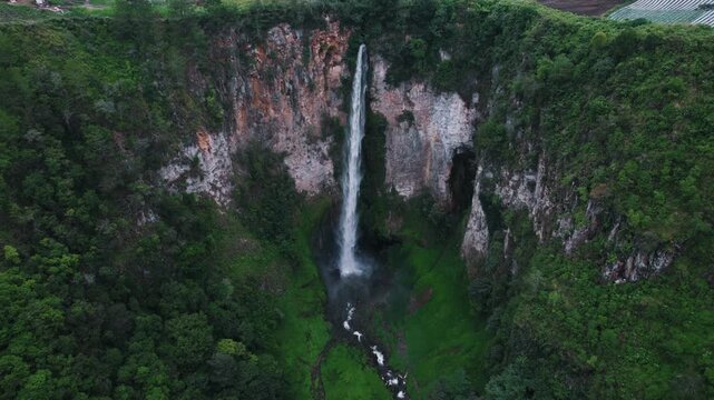 Sipiso Piso Waterfall in North Sumatra, Indonesia &ndash; Cinematic Drone Aerial View of Tropical Waterfall and Lush Mountain Landscape