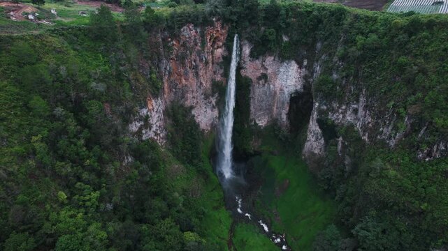 Sipiso Piso Waterfall in North Sumatra, Indonesia &ndash; Cinematic Drone Aerial View of Tropical Waterfall and Lush Mountain Landscape
