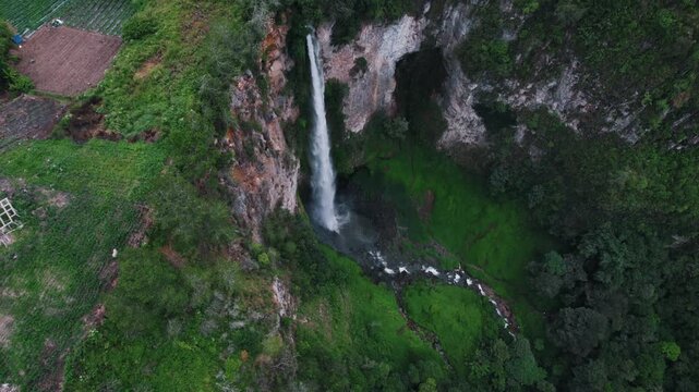 Sipiso Piso Waterfall in North Sumatra, Indonesia &ndash; Cinematic Drone Aerial View of Tropical Waterfall and Lush Mountain Landscape