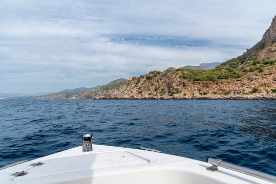 View from a boat of an Arab watchtower on the cliffs of Maro-Cerro Gordo, Andalusia, Spain
