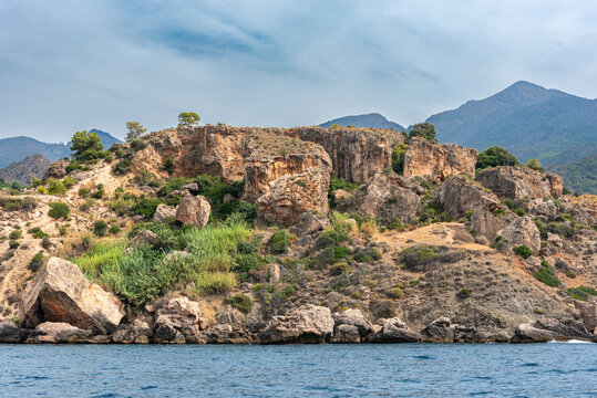 Maro-Cerro Gordo natural area viewed from the sea, with rugged rocky coastline and no beach