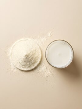 Minimalist Flat Lay of Milk Powder Pile and Glass of Milk Isolated on Warm Beige Background