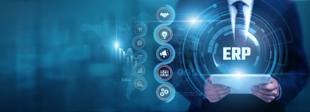 Businessman using tablet analyzing ERP and business data, monitoring operations, optimizing resources, improving workflows and supporting enterprise management