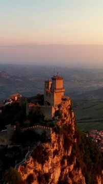 Flying over the amazing hilltop fortresses on Monte Titano in San Marino. San Marino one of the smallest countries in the world. Vertical Video.