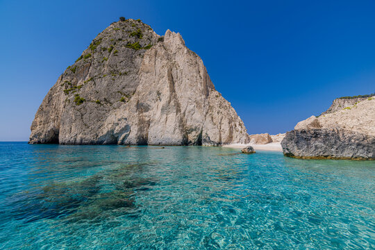 Fantastic white limestone cliffs rugged rock formation crystal turquoise sea summer Mediterranean coastline paradise. Peaceful nature seascape landscape. Scenic geology travel adventure wanderlust